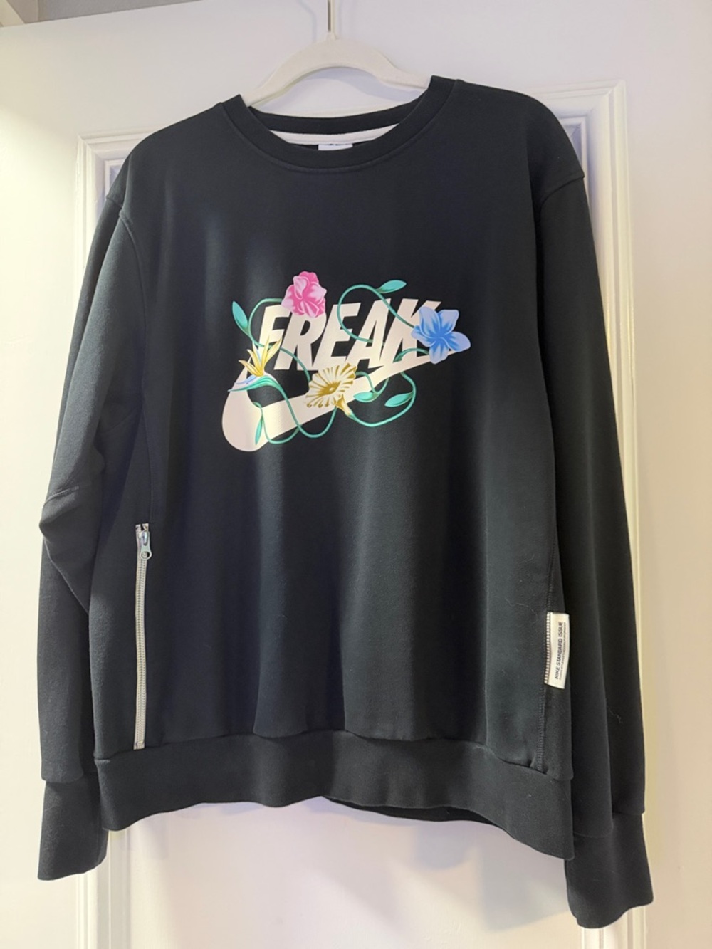 Nike Black Crewneck Sweatshirt with Colorful Floral 'FREAK' Graphic